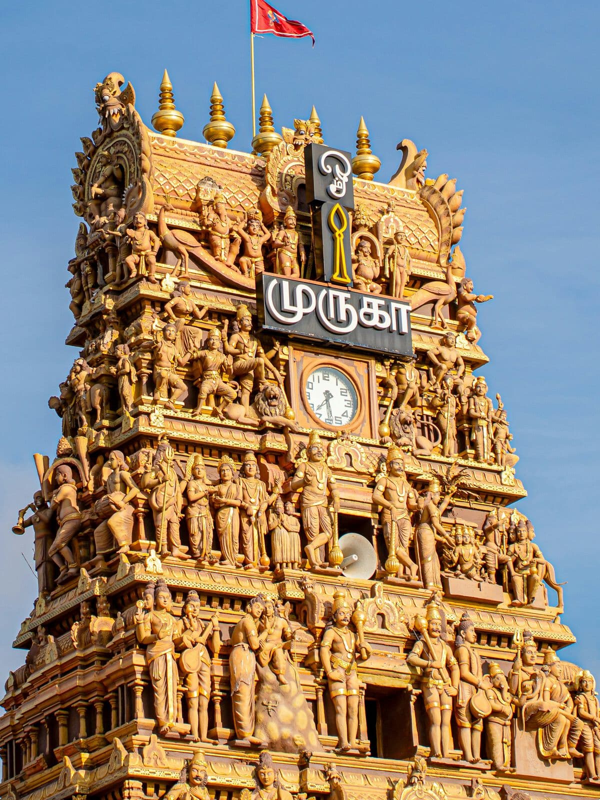 The carved gopuram of a Murugan temple
