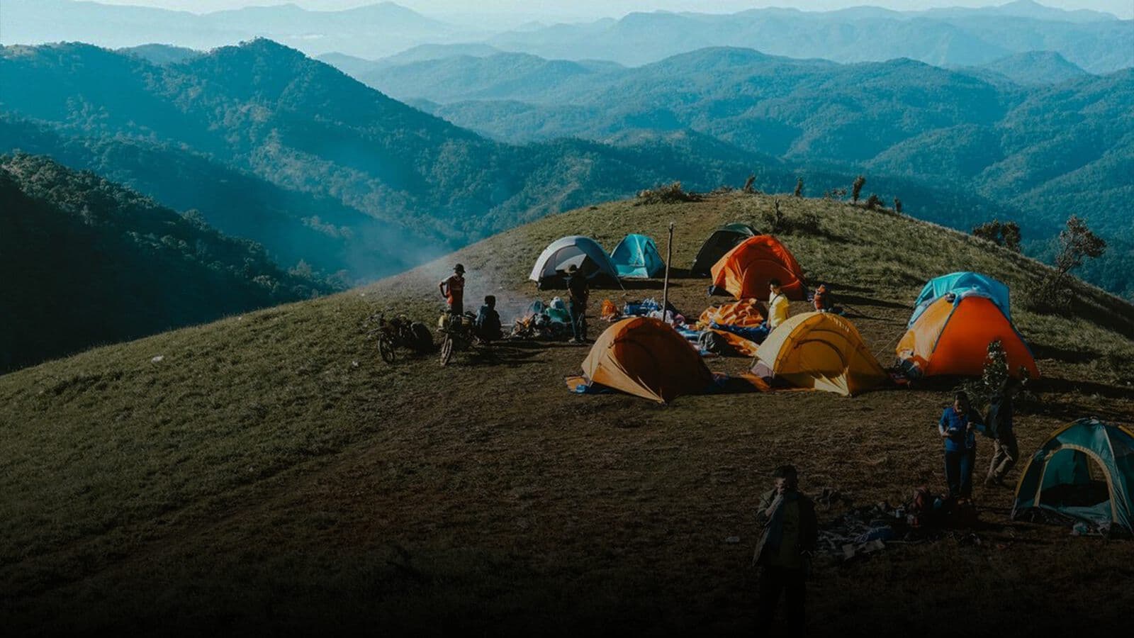 Tents pitched on a ridge above the valley