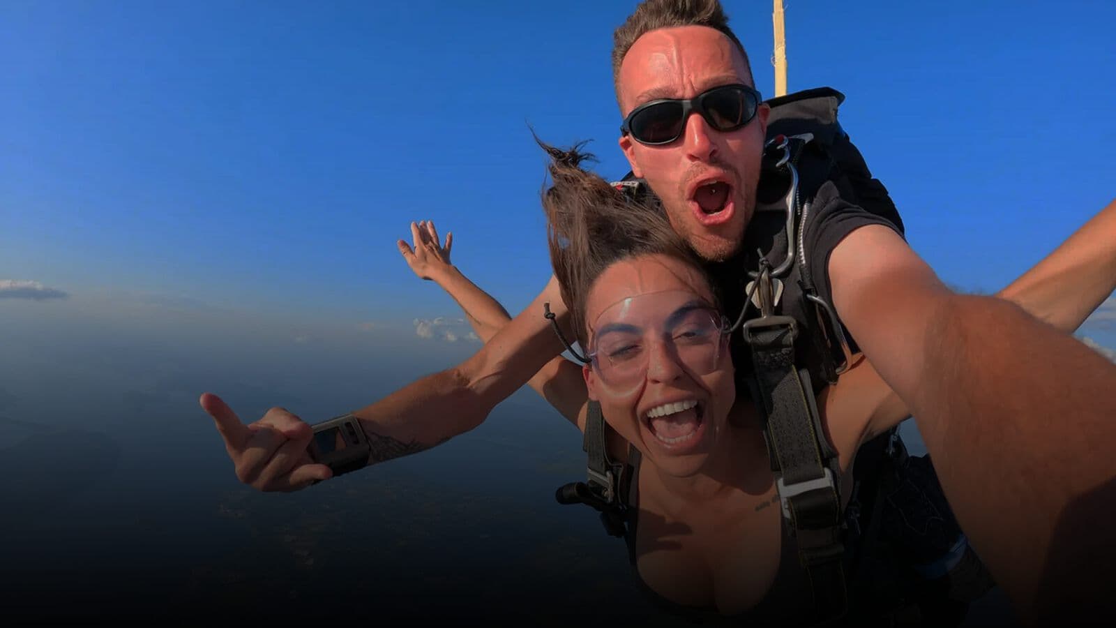 A tandem skydive above the coastline