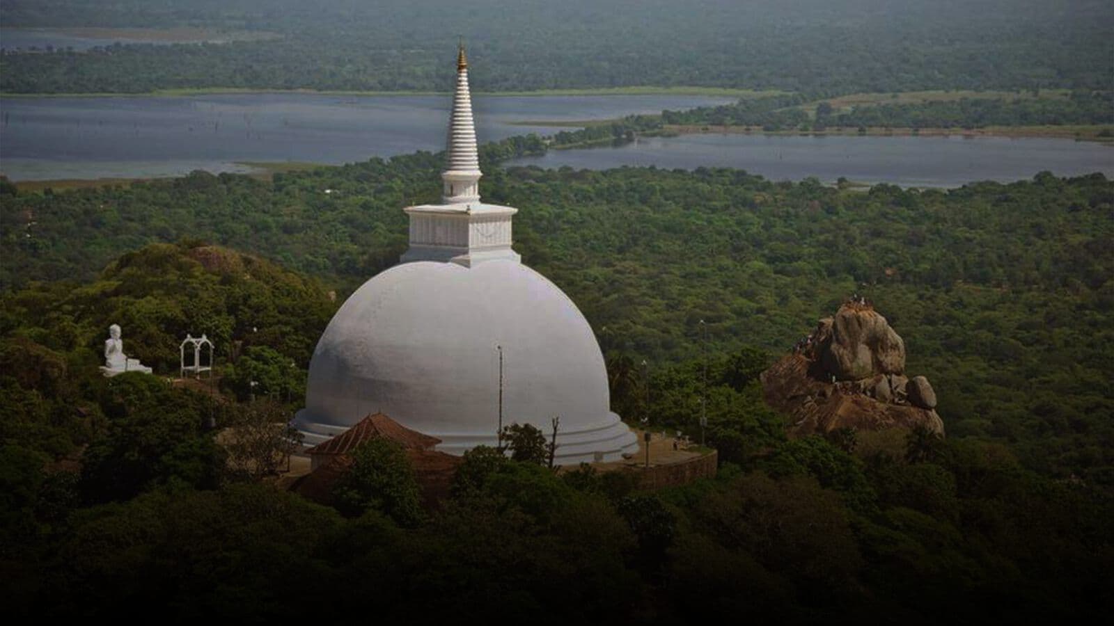 A white stupa above the treetops at Anuradhapura