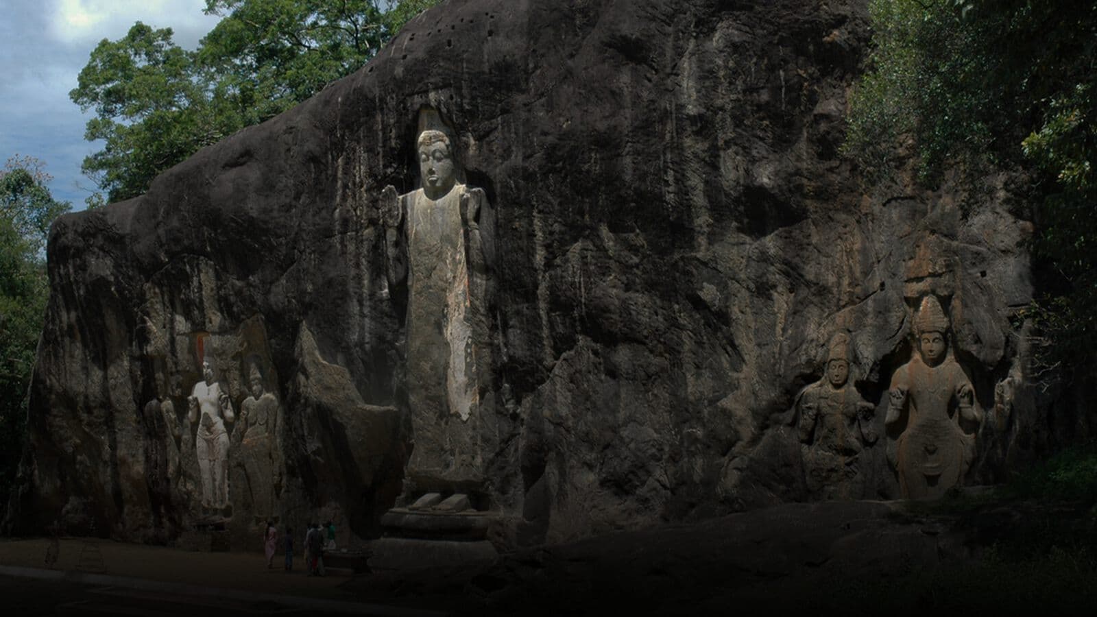 Figures carved into the rock face at Buduruwagala