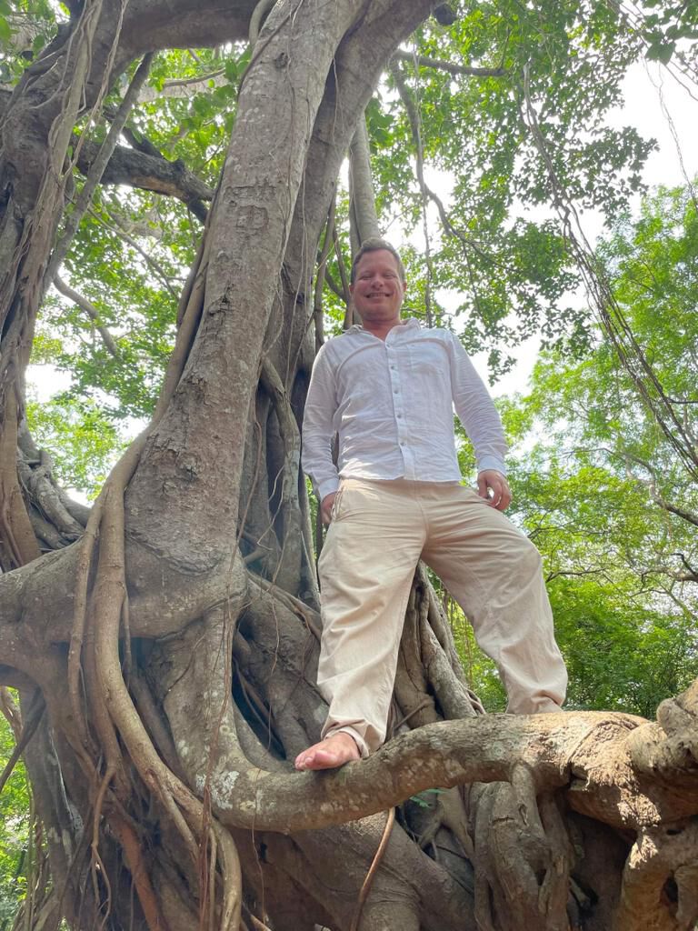 Standing in the roots of a banyan tree