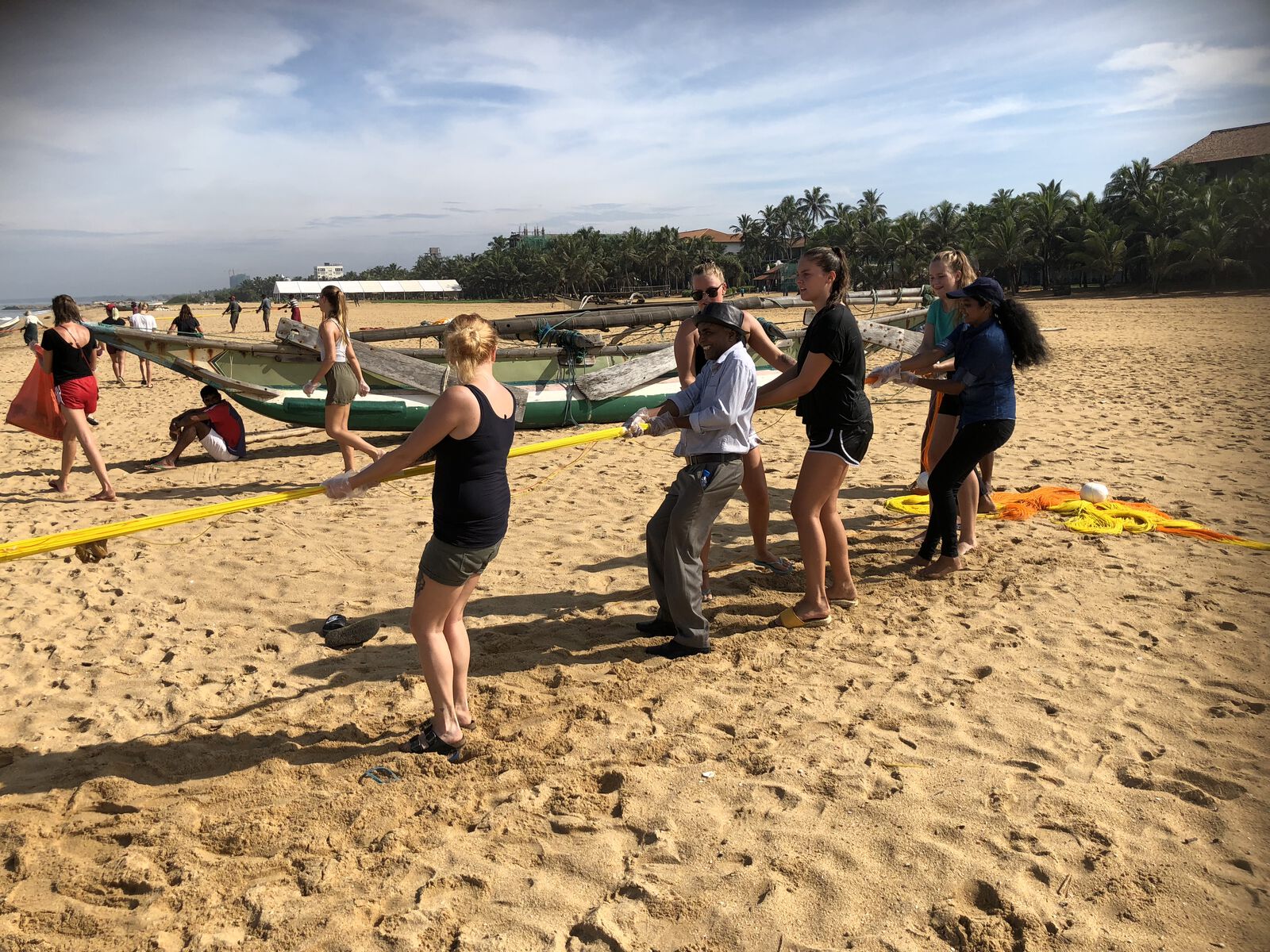 Hauling in a beach seine net with the fishermen